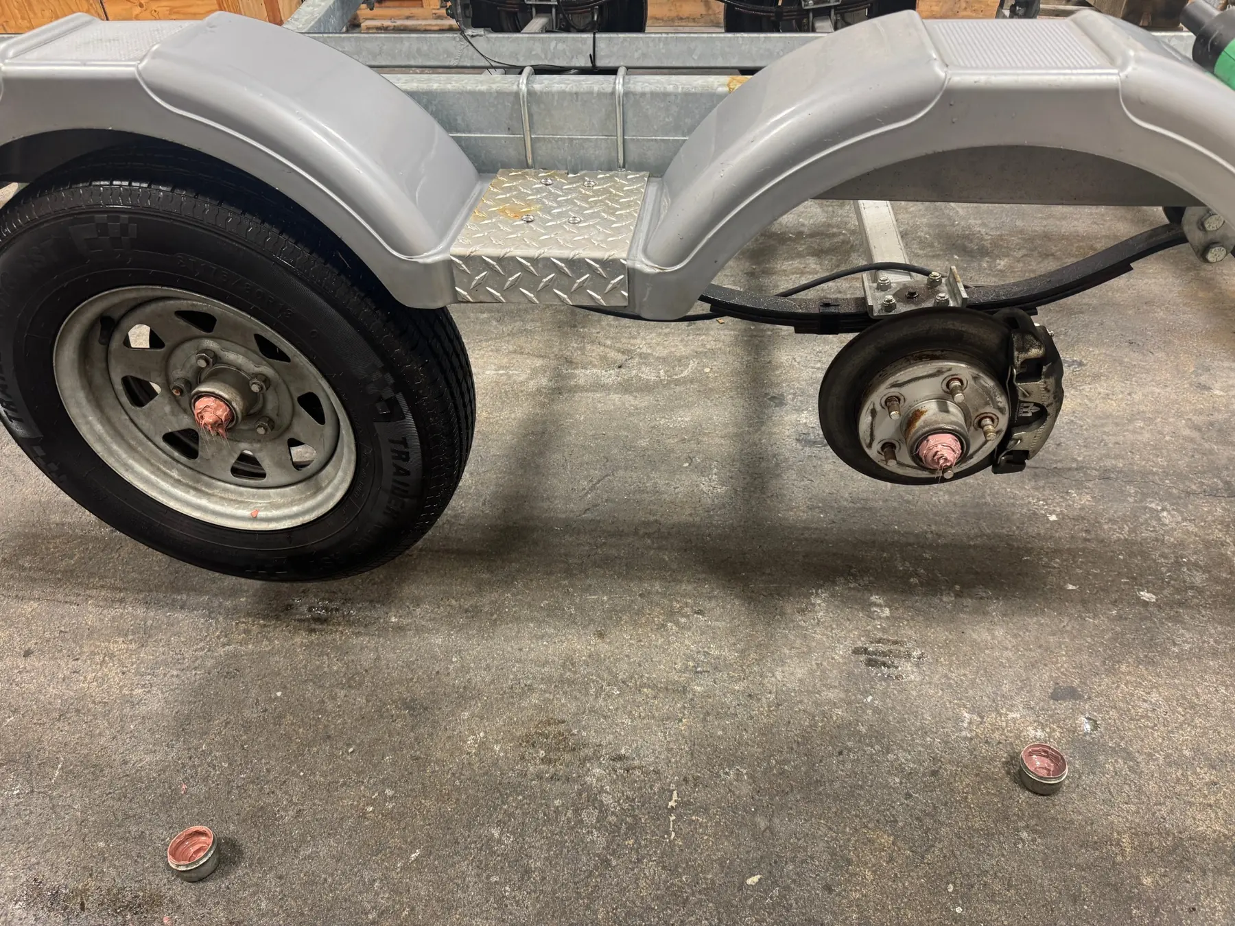 Boat trailer wheel and hub under repair